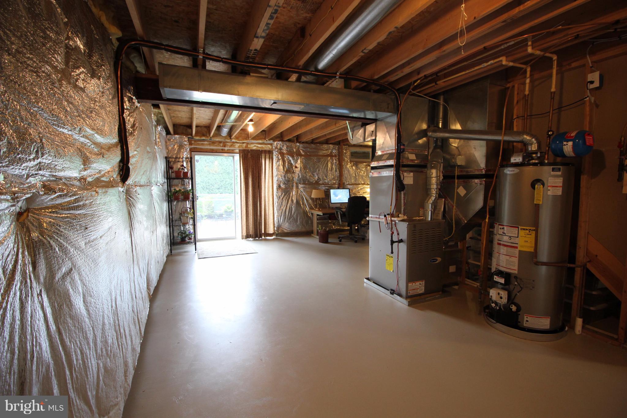 6095 Hanover Road Hanover, MD 21076 - Photo 24 of 30 a view of water heater room with wooden walls