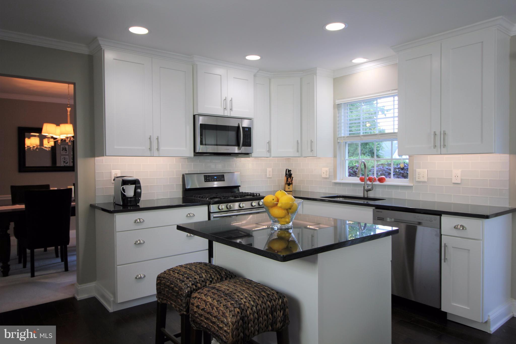 6095 Hanover Road Hanover, MD 21076 - Photo 6 of 30 a kitchen with a sink cabinets and window