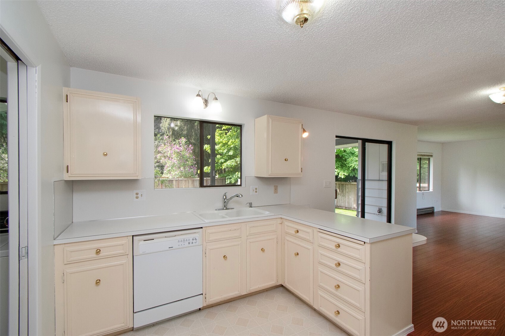 370 Dungeness Meadows Sequim, WA 98382 - Photo 14 of 40 a kitchen with sink and cabinets