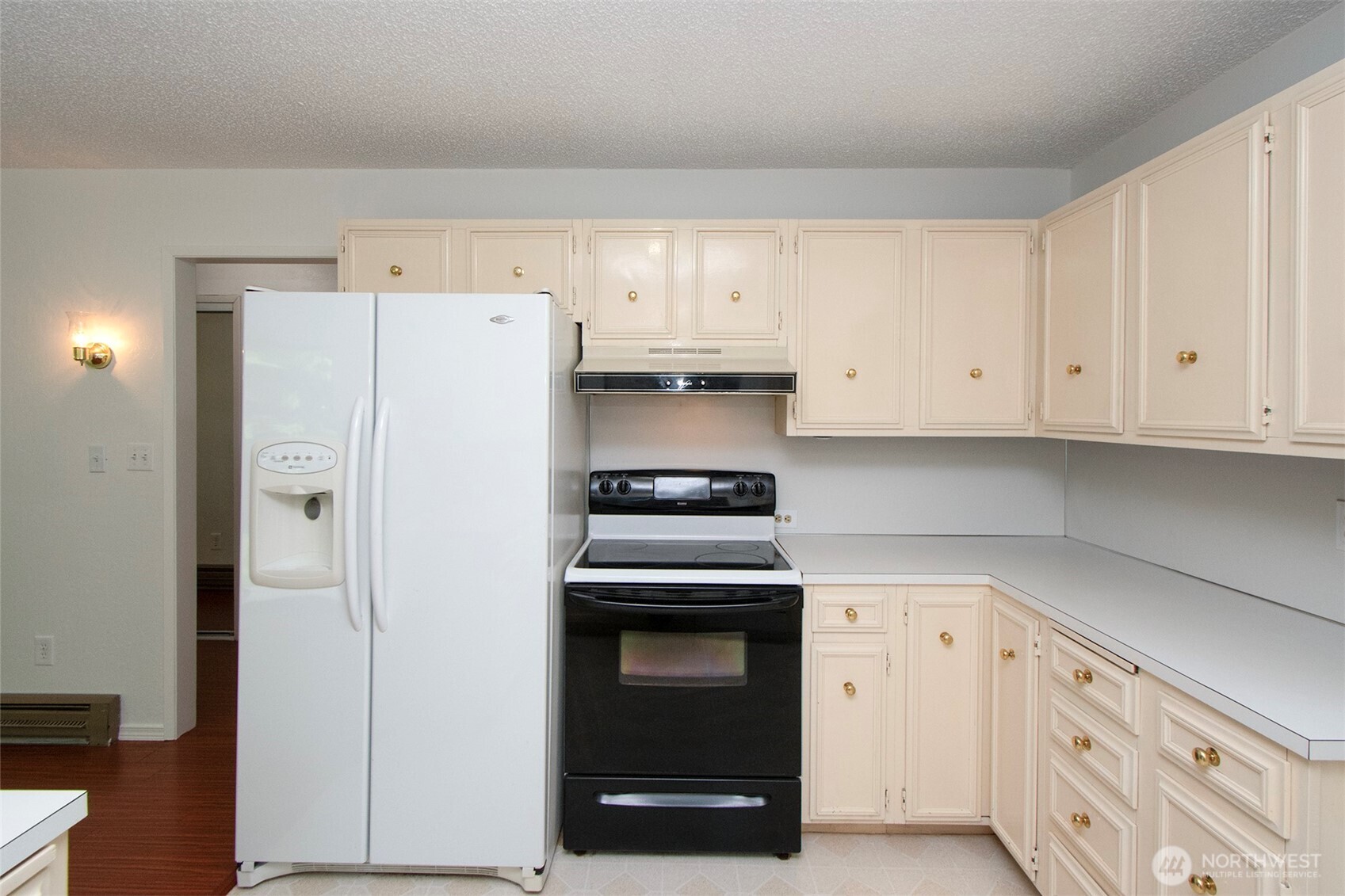 370 Dungeness Meadows Sequim, WA 98382 - Photo 15 of 40 a kitchen with cabinets and appliances