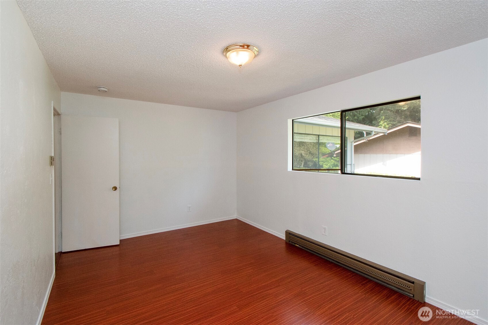 370 Dungeness Meadows Sequim, WA 98382 - Photo 21 of 40 a view of a room with wooden floor and fan