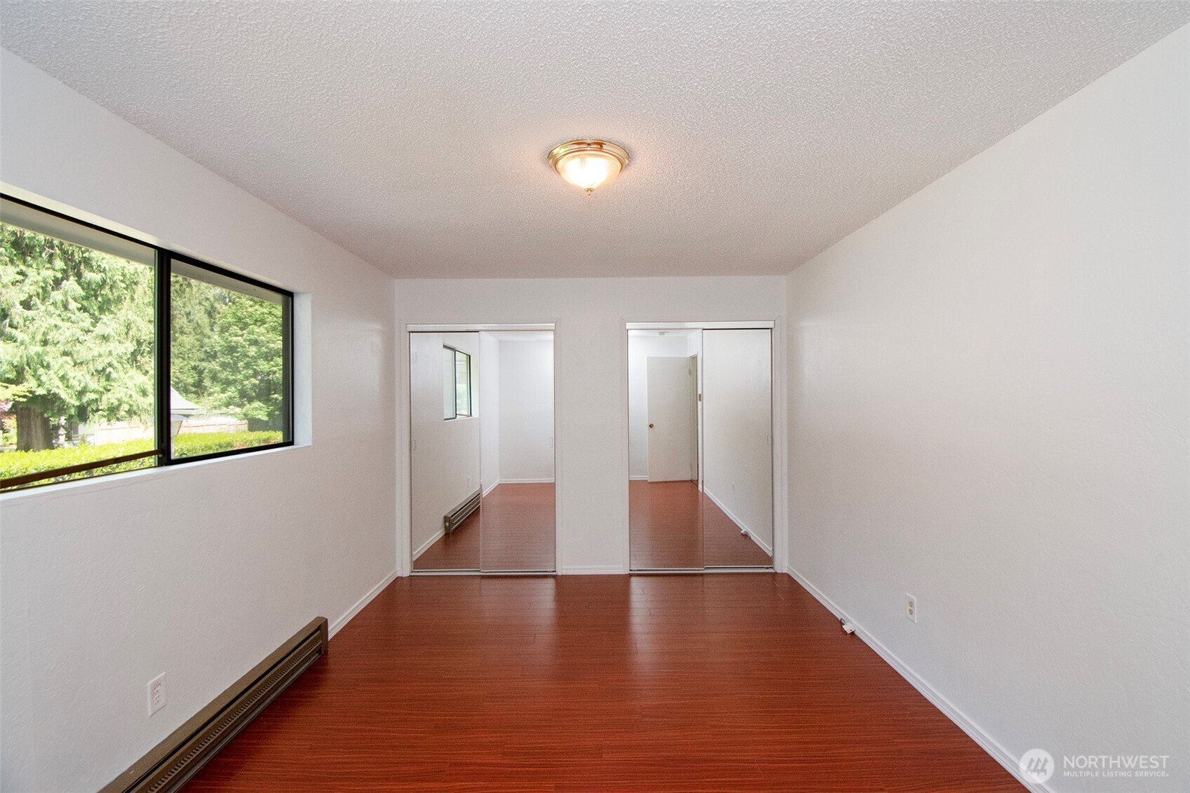 370 Dungeness Meadows Sequim, WA 98382 - Photo 22 of 40 a view of a room with wooden floor and window