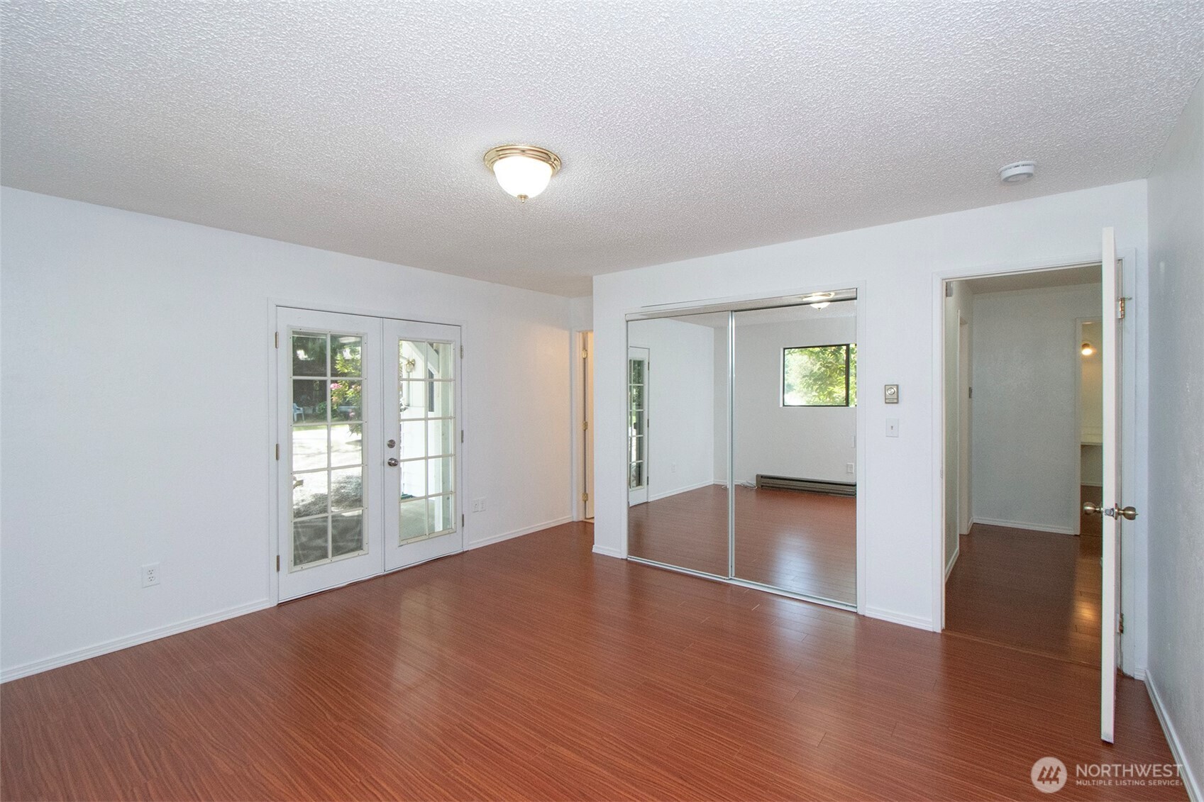 370 Dungeness Meadows Sequim, WA 98382 - Photo 24 of 40 wooden floor in an empty room with a window