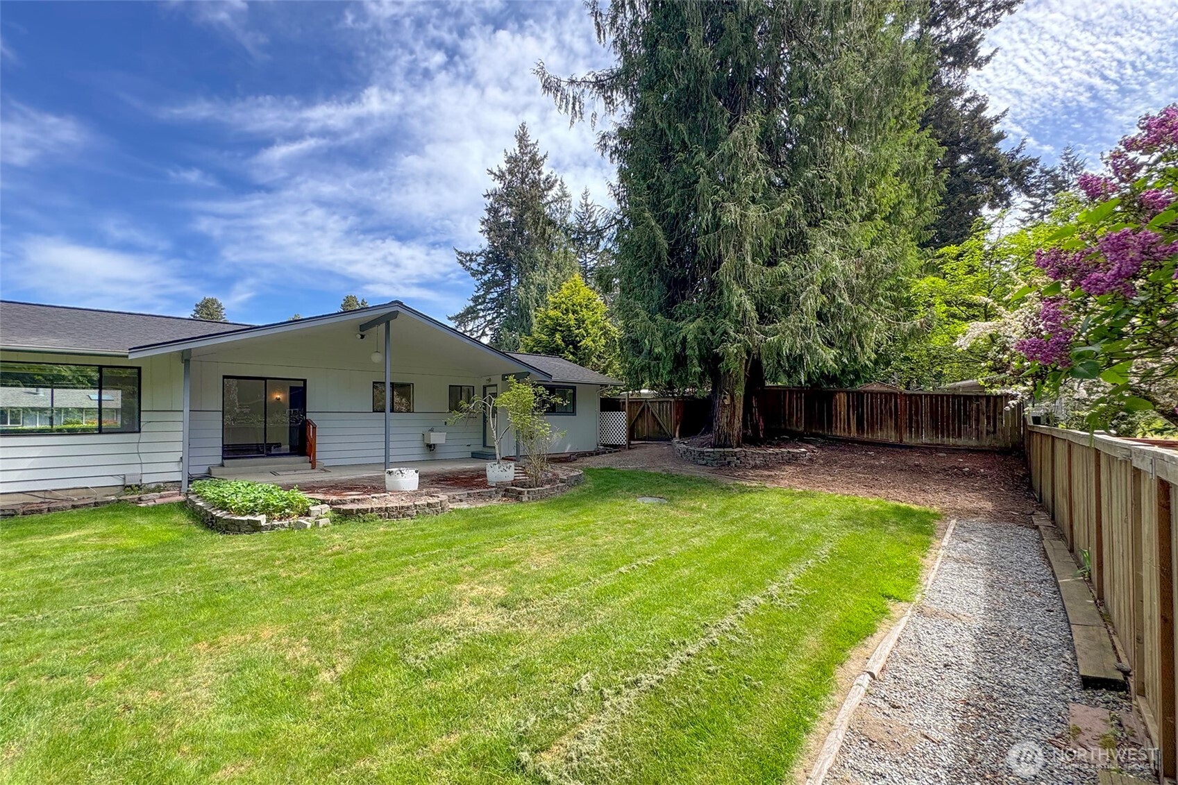 370 Dungeness Meadows Sequim, WA 98382 - Photo 35 of 40 a view of a house with a yard patio and a slide