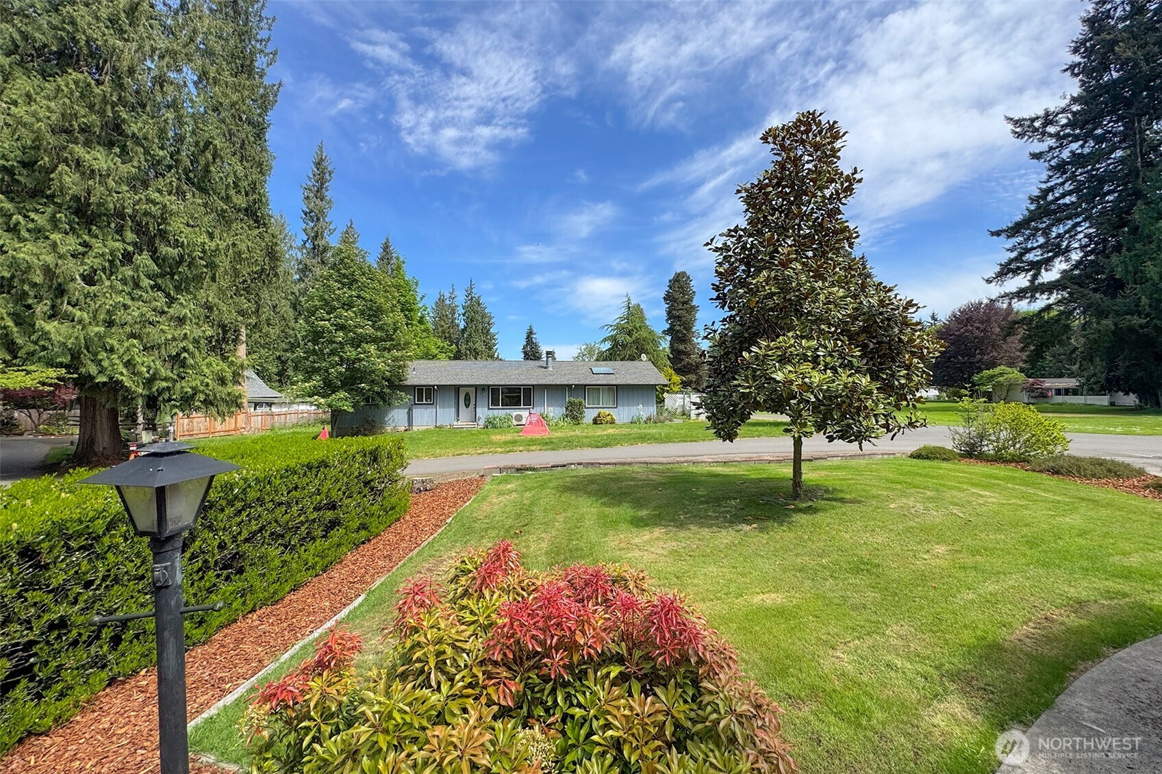 370 Dungeness Meadows Sequim, WA 98382 - Photo 37 of 40 a view of a garden with a house