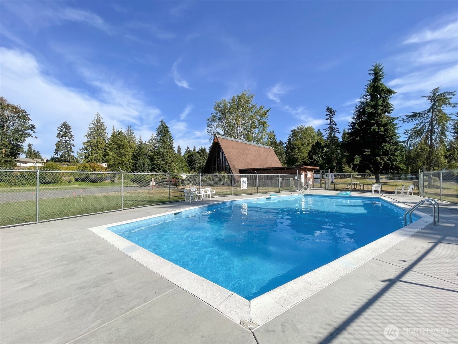 370 Dungeness Meadows Sequim, WA 98382 - Photo 39 of 40 a view of a swimming pool with an outdoor seating