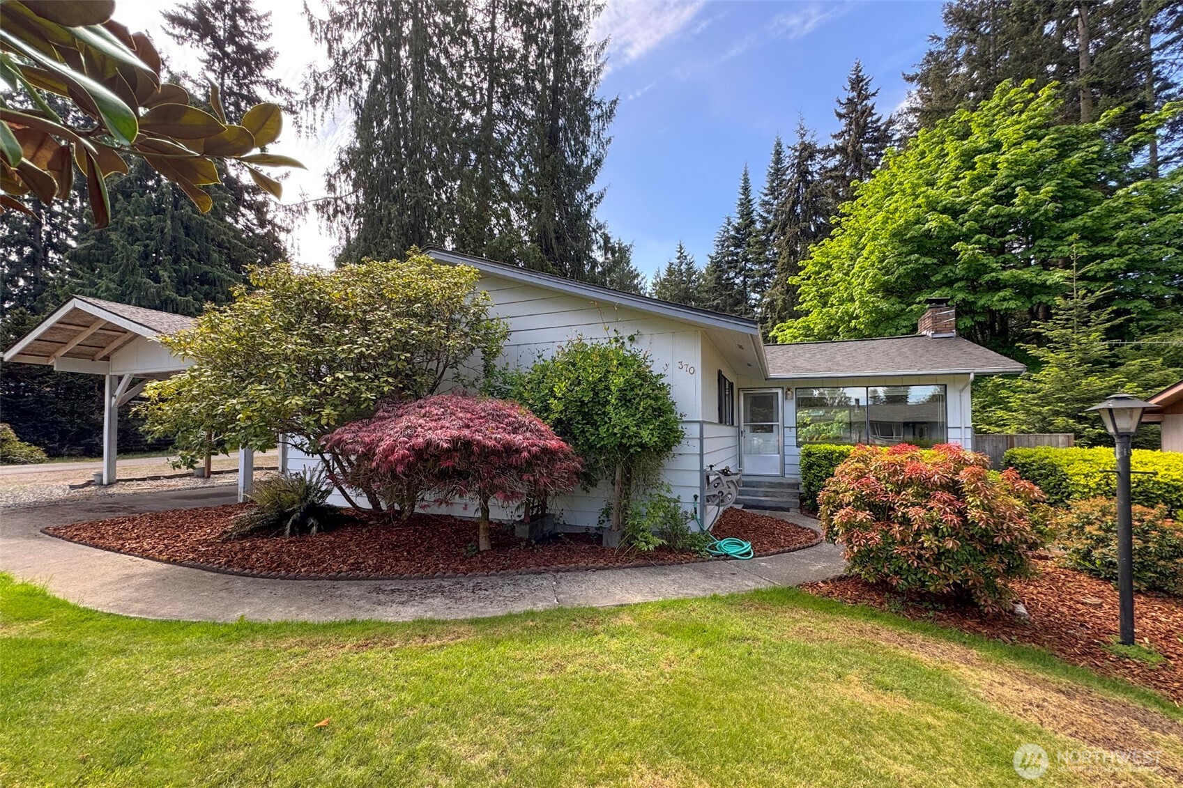 370 Dungeness Meadows Sequim, WA 98382 - Photo 4 of 40 a view of a house with backyard and sitting area