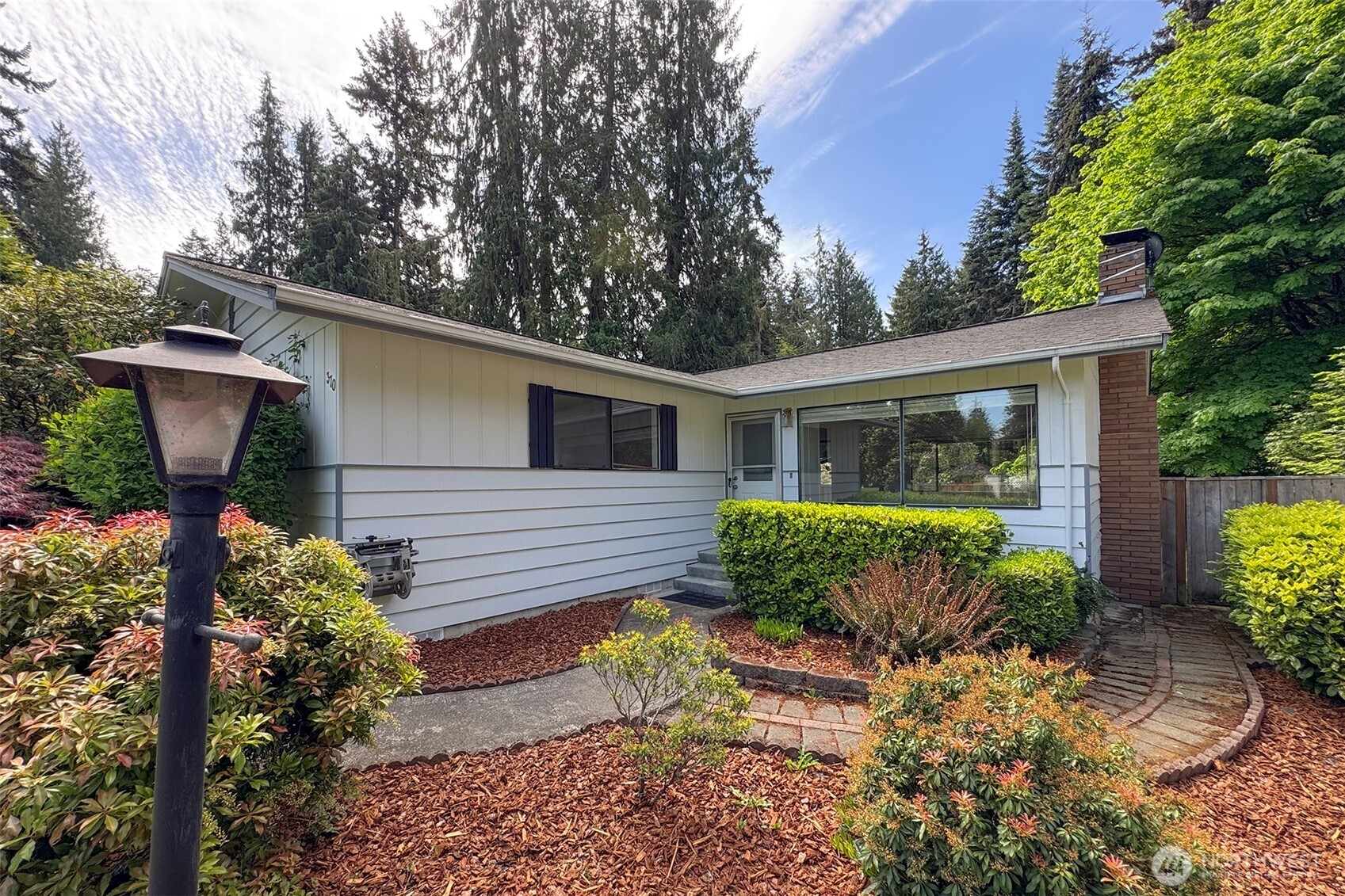 370 Dungeness Meadows Sequim, WA 98382 - Photo 5 of 40 a front view of a house with garden