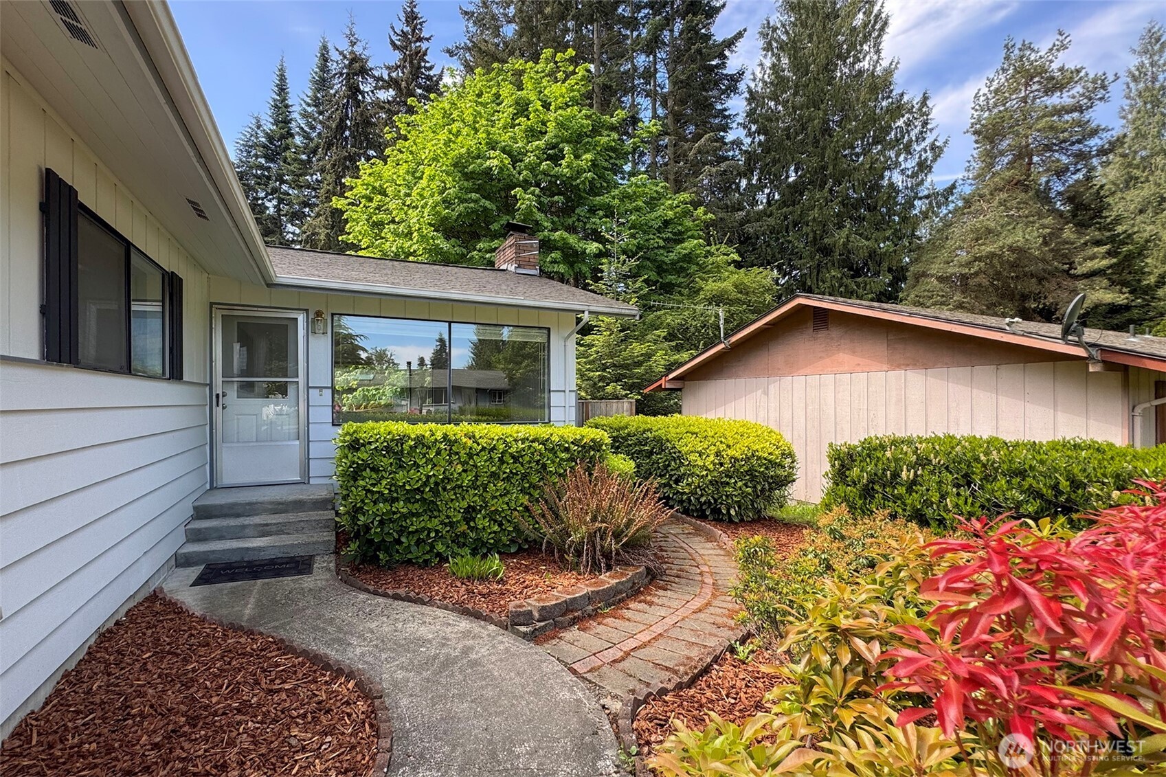 370 Dungeness Meadows Sequim, WA 98382 - Photo 6 of 40 a front view of a house with garden