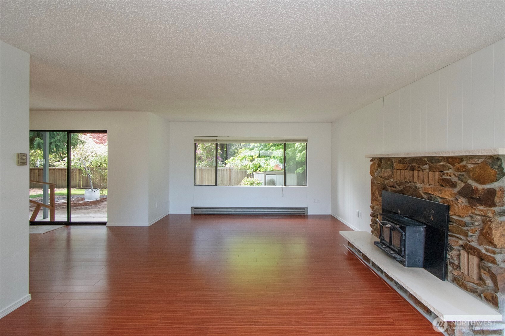 370 Dungeness Meadows Sequim, WA 98382 - Photo 8 of 40 wooden floor in an empty room with a window