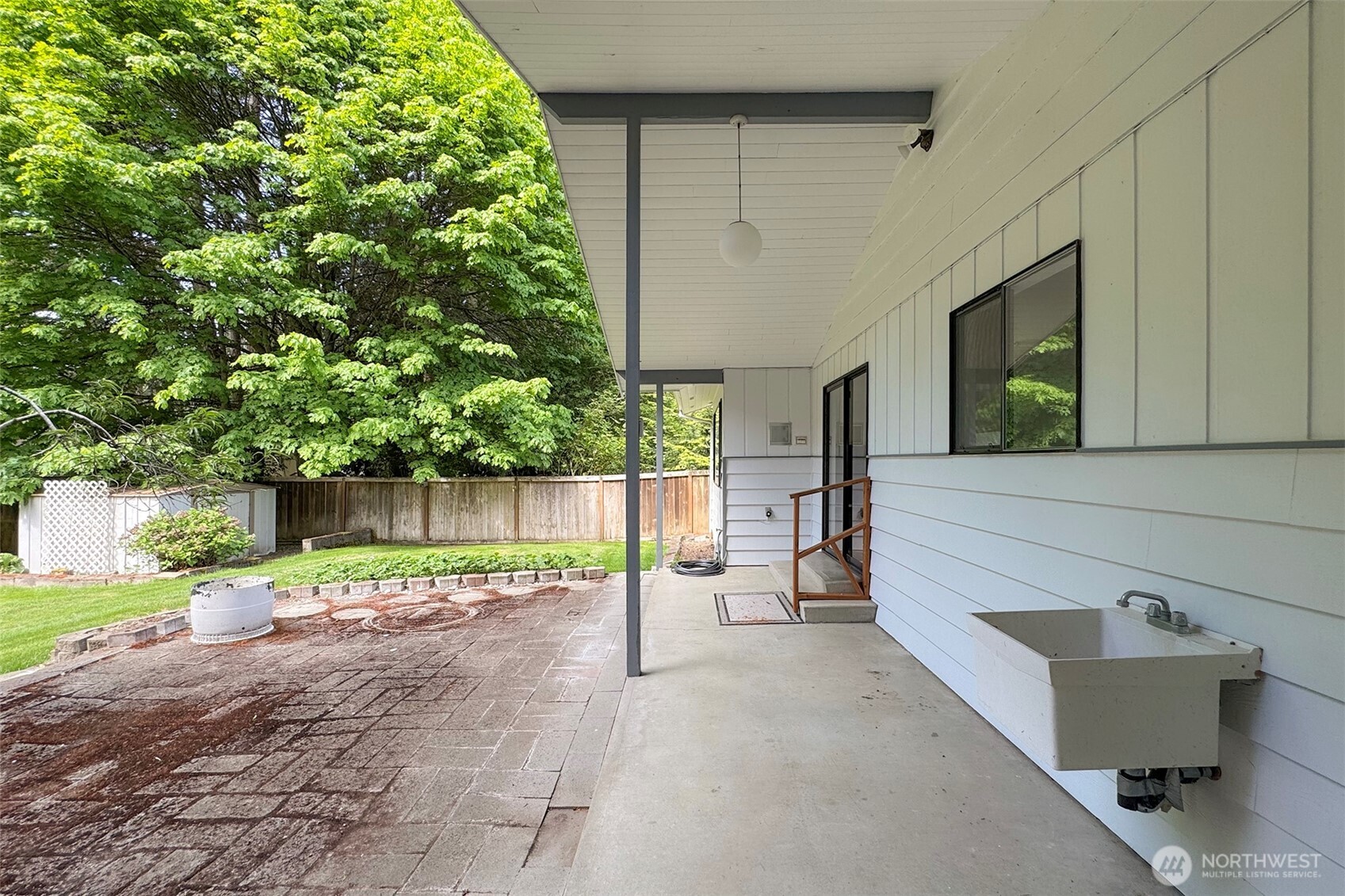370 Dungeness Meadows Sequim, WA 98382 - Photo 10 of 40 a backyard of a house with table and chairs