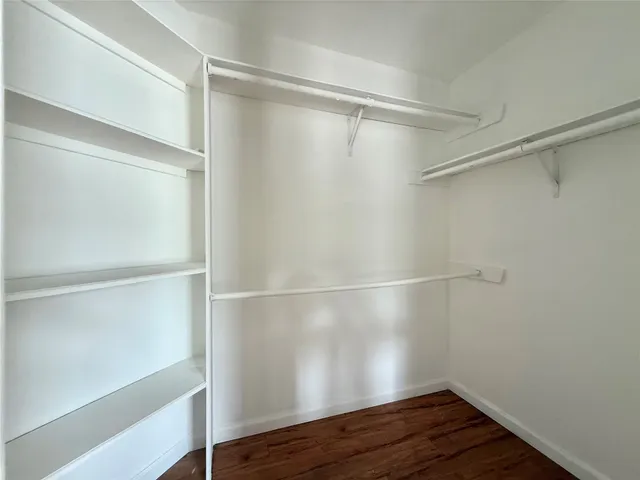a view of an empty walk in closet