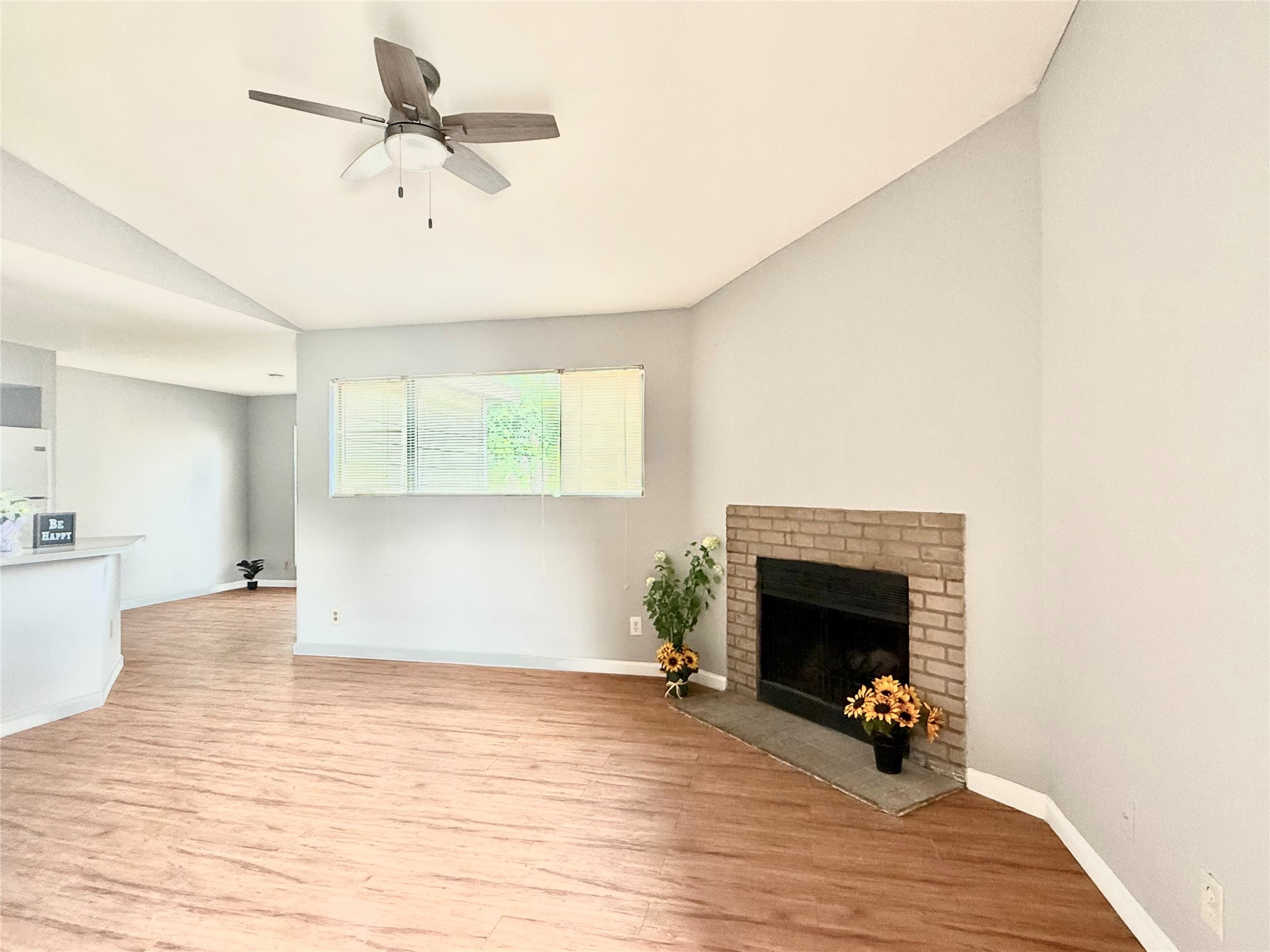 7200 West T C Jester Boulevard, Unit 3902 North Houston, TX 77088 - Photo 6 of 16 a view of empty room with wooden floor and fireplace