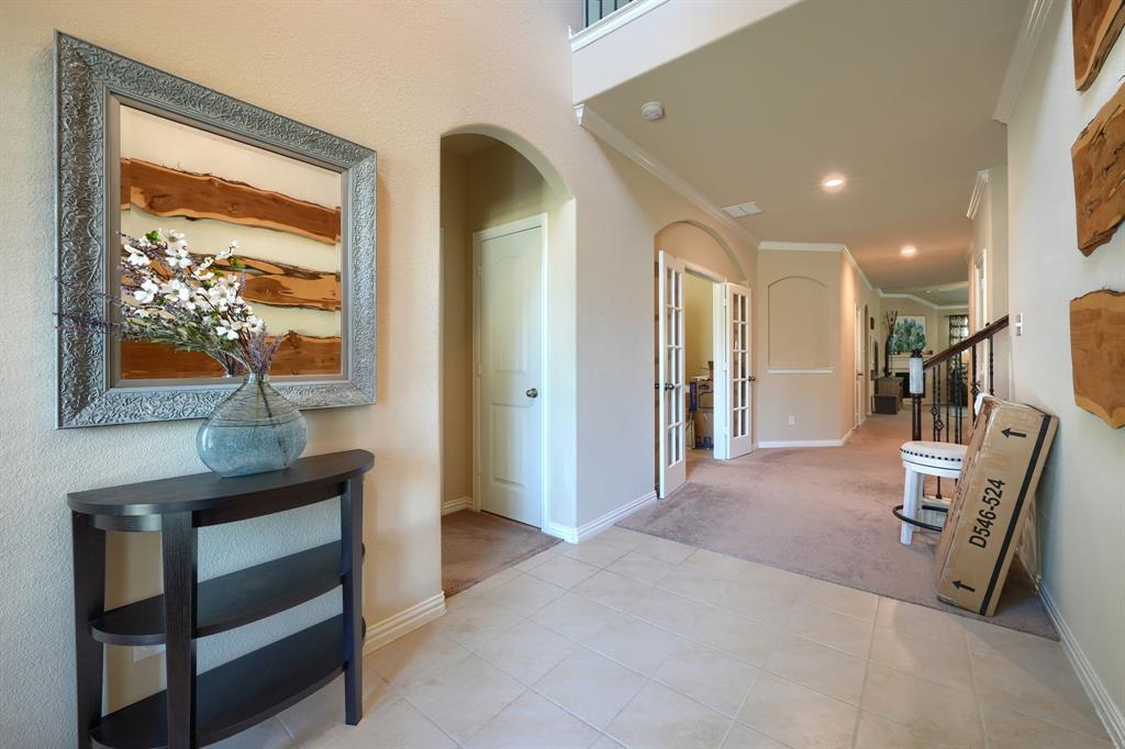 12417 Hitch Rack Way McKinney, TX 75071 - Photo 2 of 17 Corridor with light carpet and ornamental molding