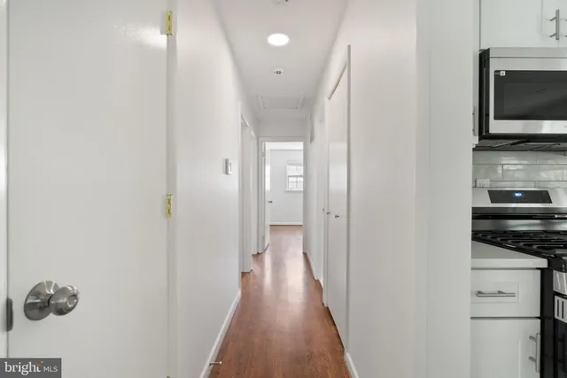 a view of a kitchen from the hallway
