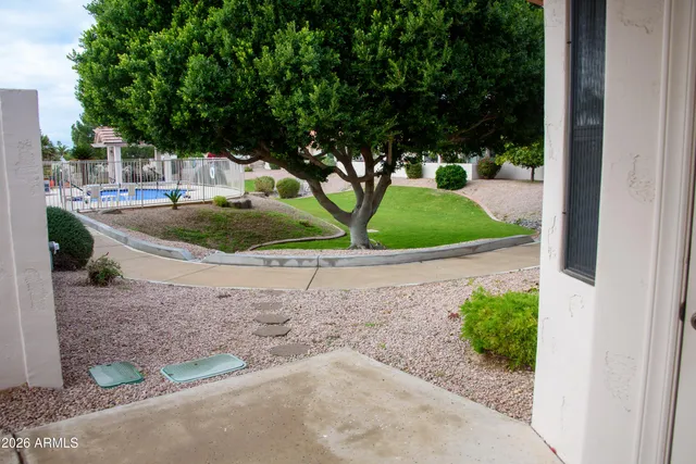 a view of a fountain in front of a house