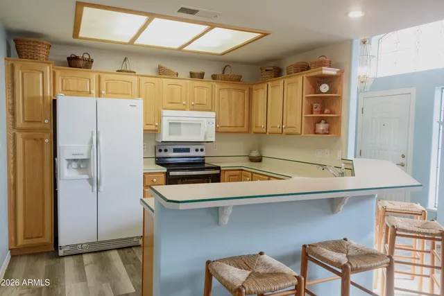 a kitchen with stainless steel appliances a refrigerator and a stove