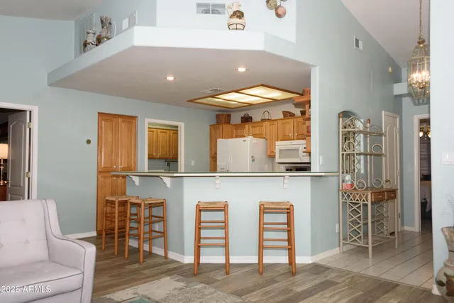 a dinning room with a table and chairs