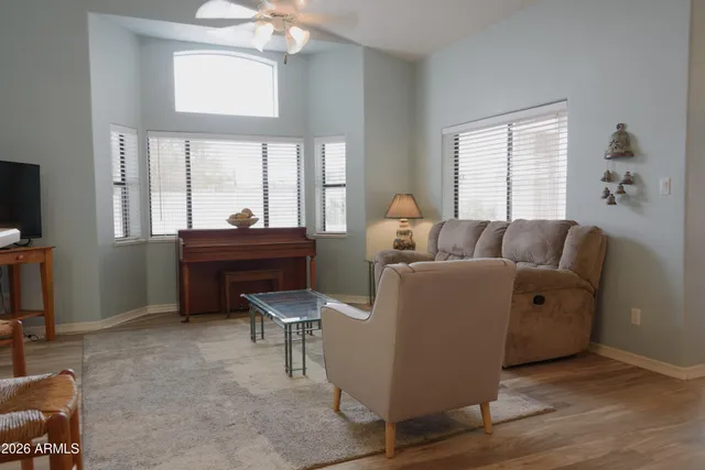 a living room with furniture and a window
