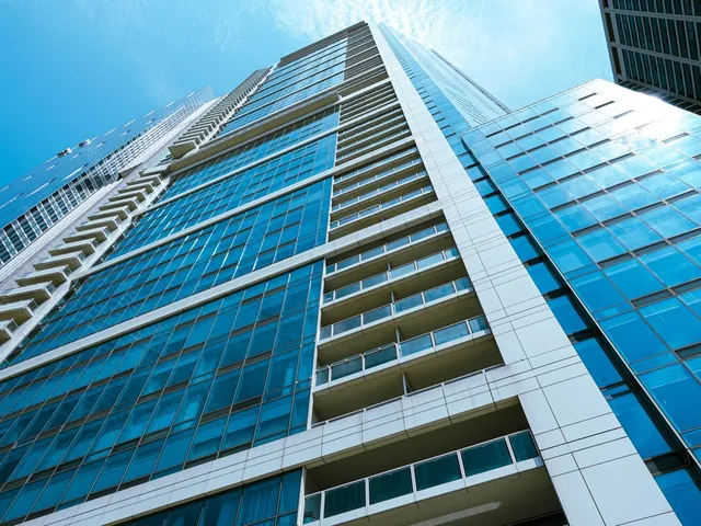a balcony with view of stairs and a wooden floor