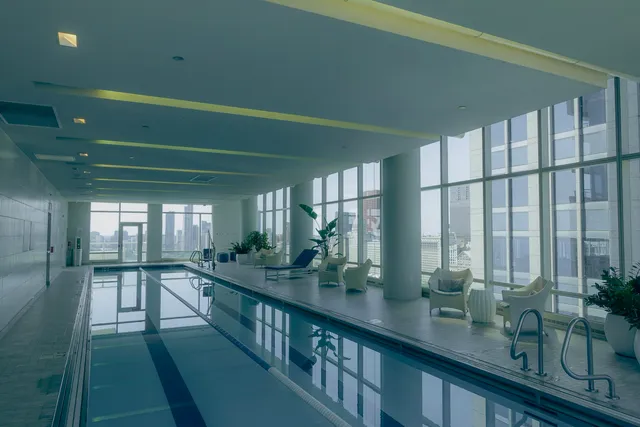 a view of a room with window and hardwood floor