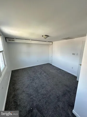 an empty room with a empty space and window