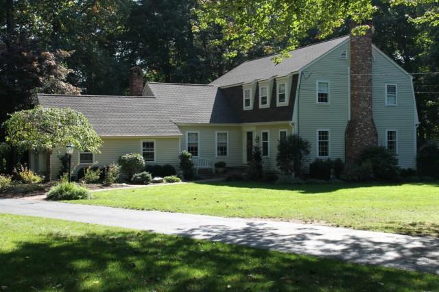 135 Bittersweet Road Fairfield, CT 06824 - Photo 1 of 1 a front view of a house with yard and green space