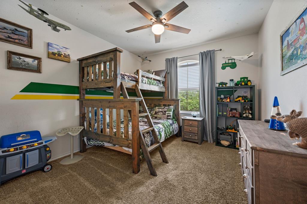 15817 White Mill Road Fort Worth, TX 76177 - Photo 20 of 27 a bedroom with furniture a air conditioner and a window