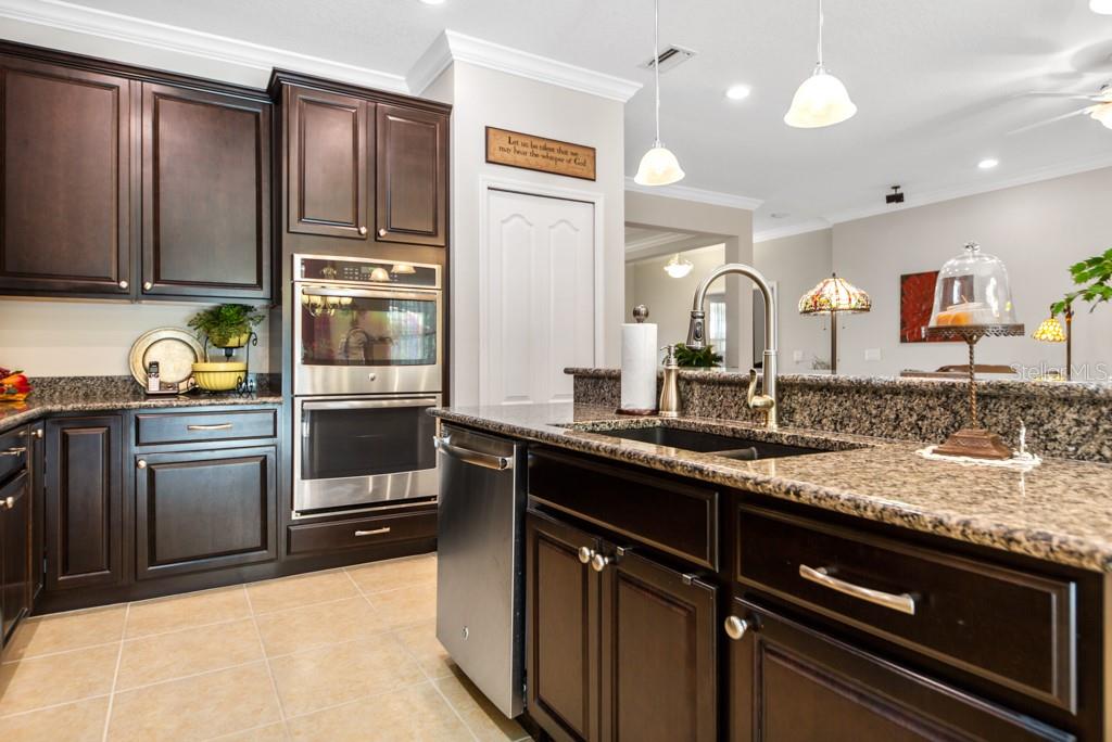 15437 Mulholland Road Parrish, FL 34219 - Photo 14 of 47 Within this beautifully appointed Kitchen, you'll see Double Convection Ovens, Dishwater, Double Sink & beautiful cabinetry!
