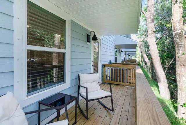 a view of a balcony with chairs