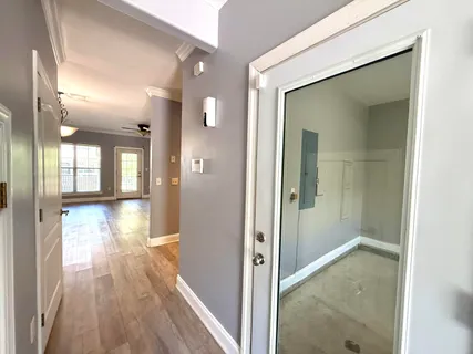 a view of a room with wooden floor