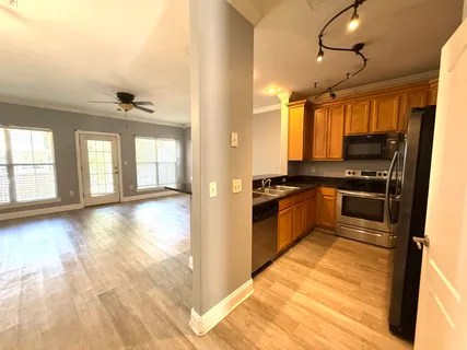 a view of a kitchen and a window