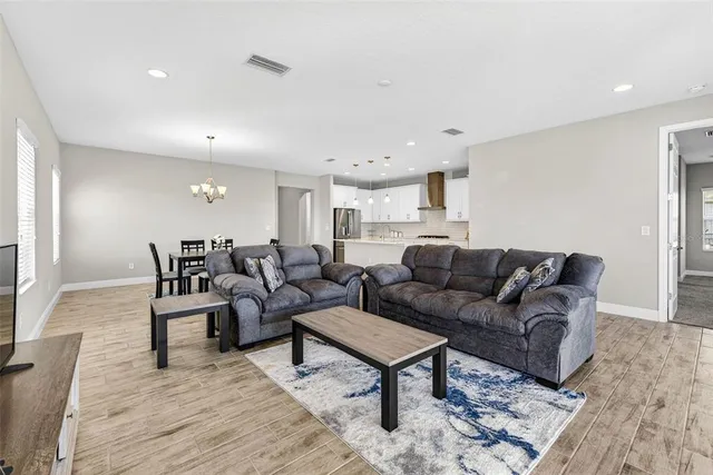 a large bedroom with a bed and glass window