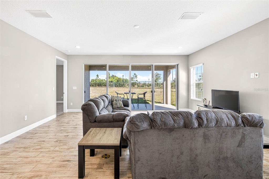 6394 Roadstead Court Apollo Beach, FL 33572 - Photo 17 of 49 a large bedroom with a bed and glass window