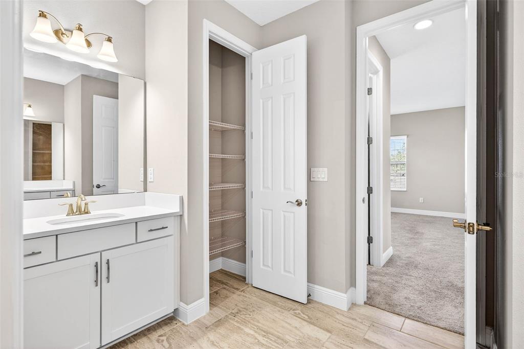 6394 Roadstead Court Apollo Beach, FL 33572 - Photo 24 of 49 a bathroom with a double vanity sink and mirror