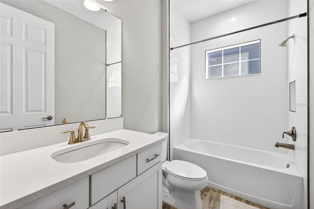 6394 Roadstead Court Apollo Beach, FL 33572 - Photo 30 of 49 a bathroom with a sink toilet a mirror and shower