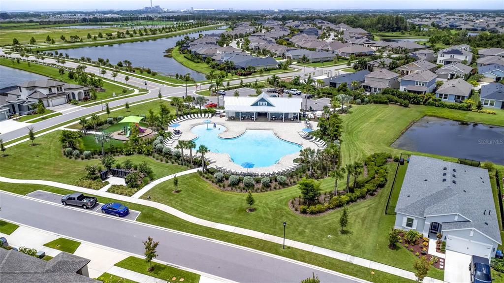6394 Roadstead Court Apollo Beach, FL 33572 - Photo 40 of 49 an aerial view of residential houses with outdoor space and a lake view