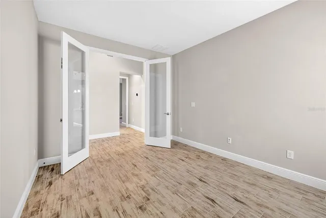 a kitchen with kitchen island stainless steel appliances a sink and counter space