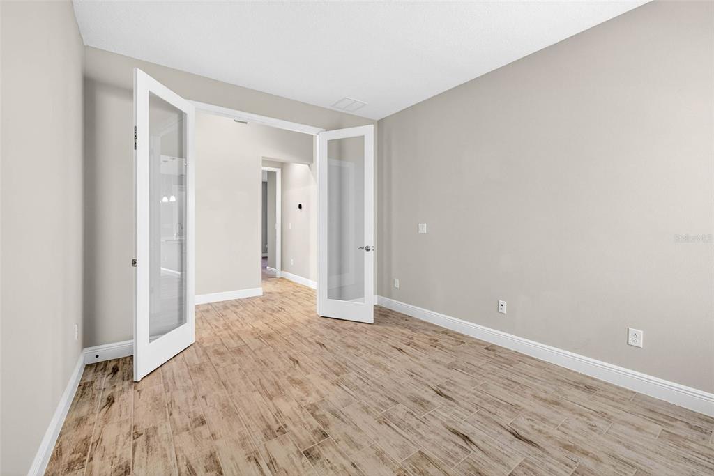 6394 Roadstead Court Apollo Beach, FL 33572 - Photo 9 of 49 a view of empty room with wooden floor