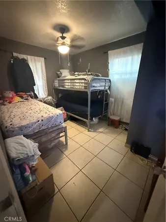 a bedroom with bed and window