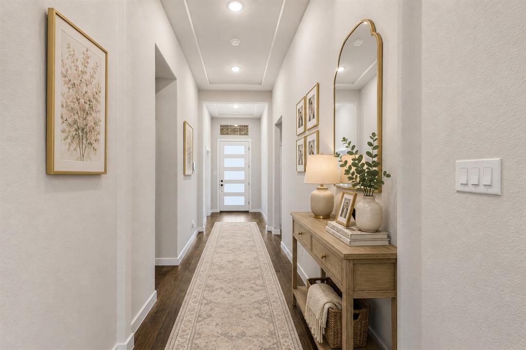 3311 Willena Road Melissa, TX 75454 - Photo 7 of 40 Hallway featuring dark wood-finish flooring, recessed lighting, and a tray ceiling detail