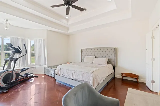 a bedroom with a bed and a view of bedroom