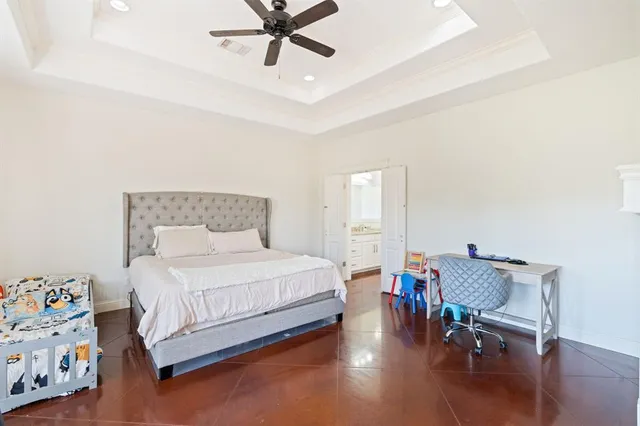 a bedroom with a bed furniture and wooden floor