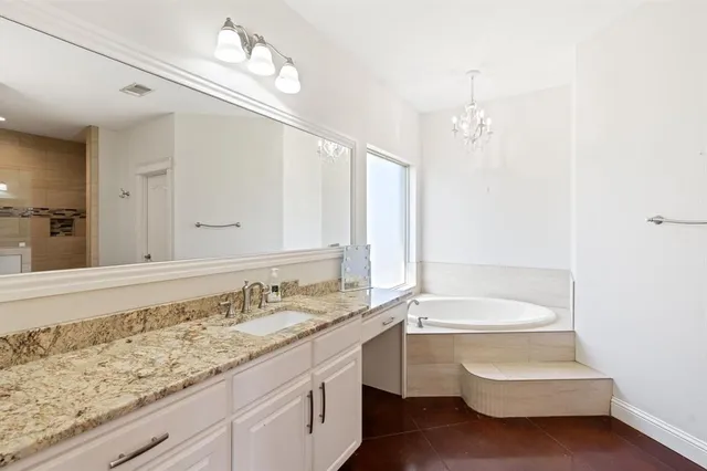a bathroom with a sink and a bathtub
