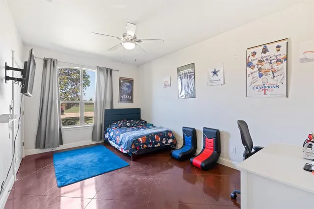 a bedroom with furniture and window