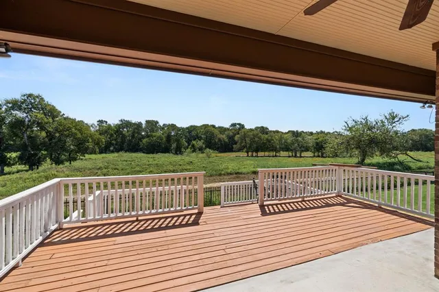 a terrace view with glass windows and wooden floor