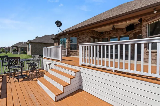 a view of a balcony with chairs