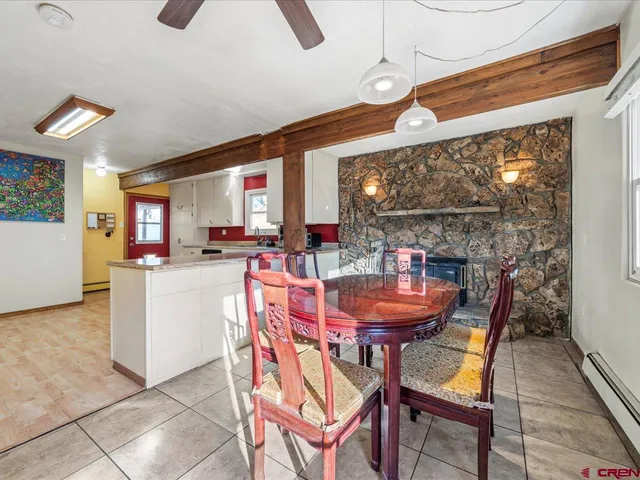 a dining room with furniture and window
