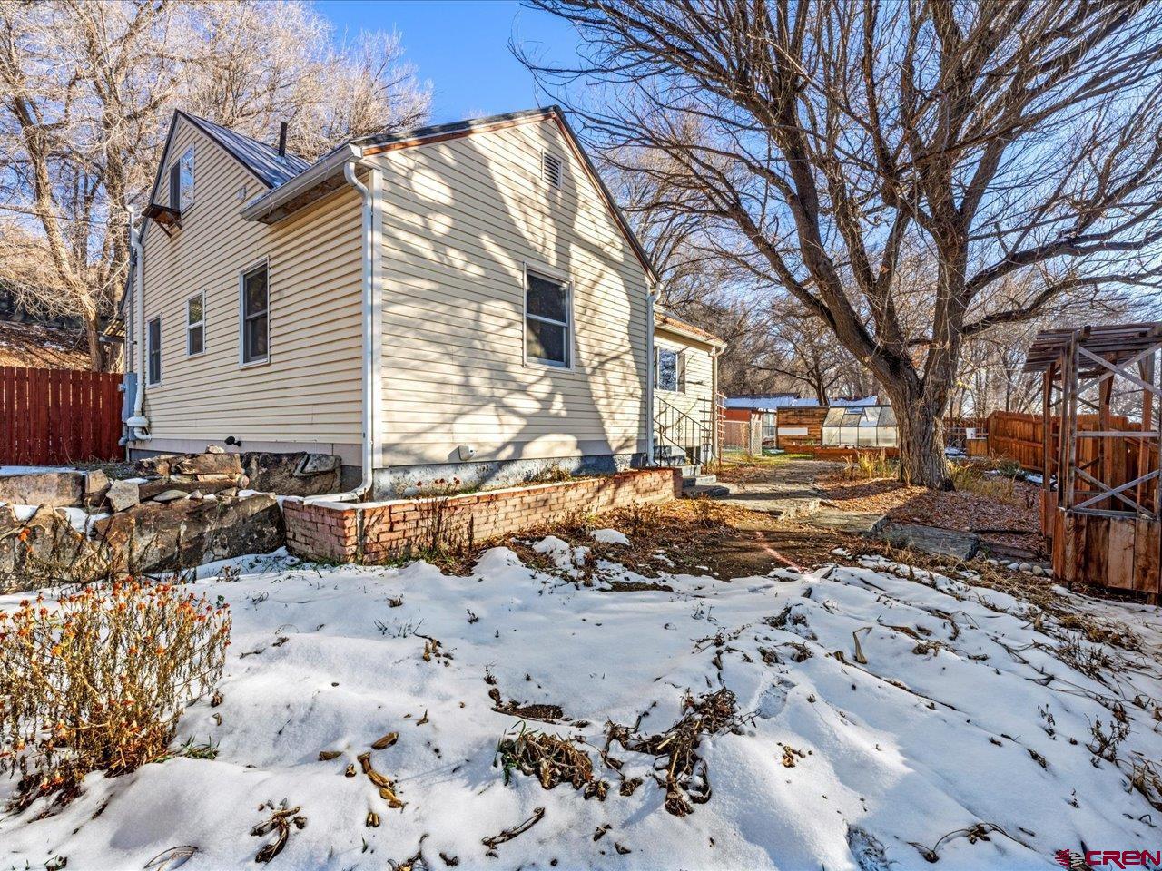 608 Bluff Street Delta, CO 81416 - Photo 19 of 45 a view of a yard with a large tree