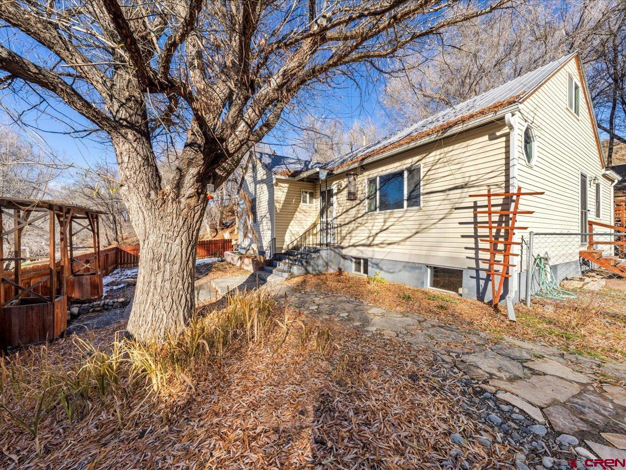 608 Bluff Street Delta, CO 81416 - Photo 21 of 45 a view of a house with a snow in the yard